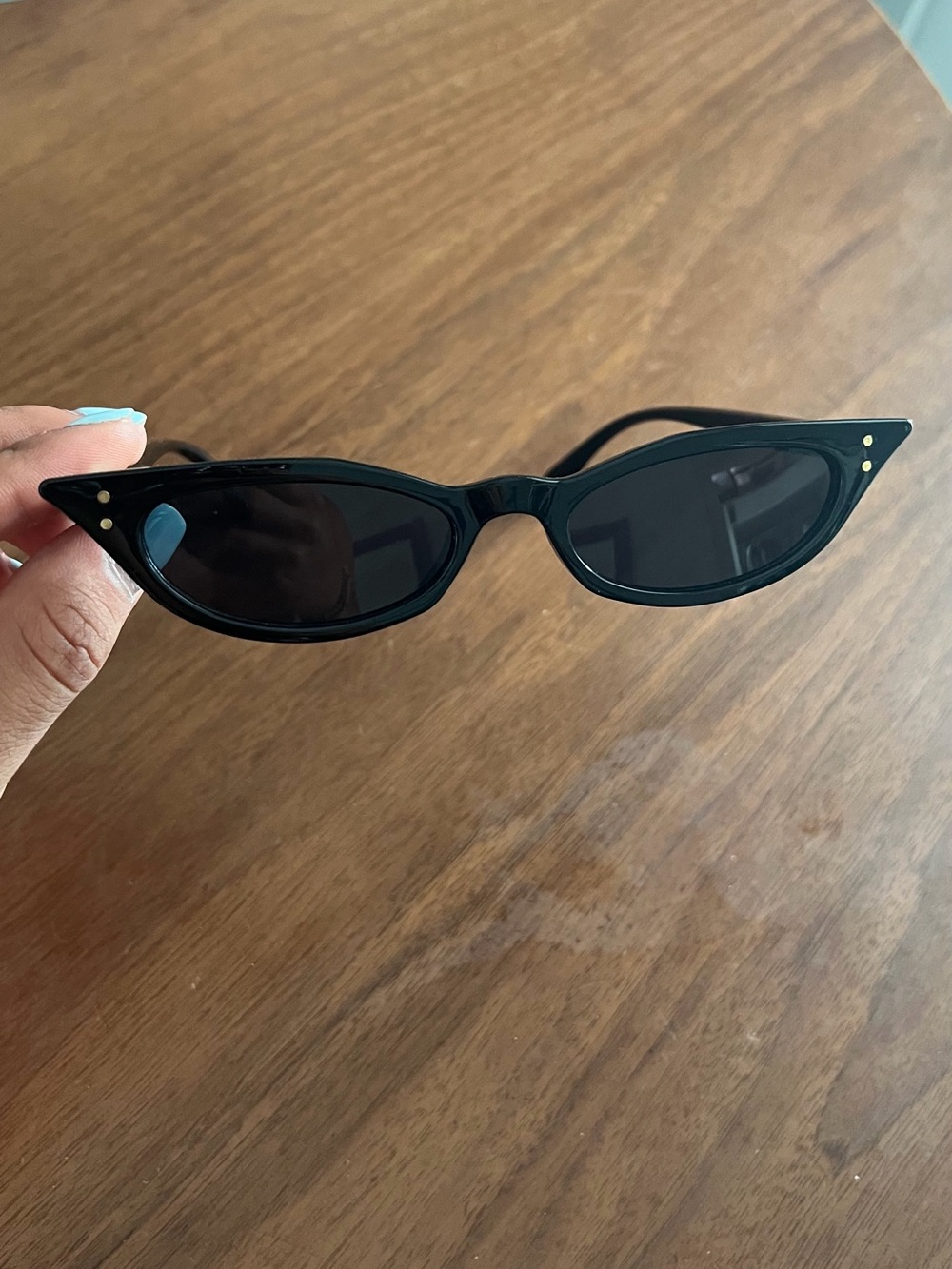 Black narrow-frame cat-eye sunglasses